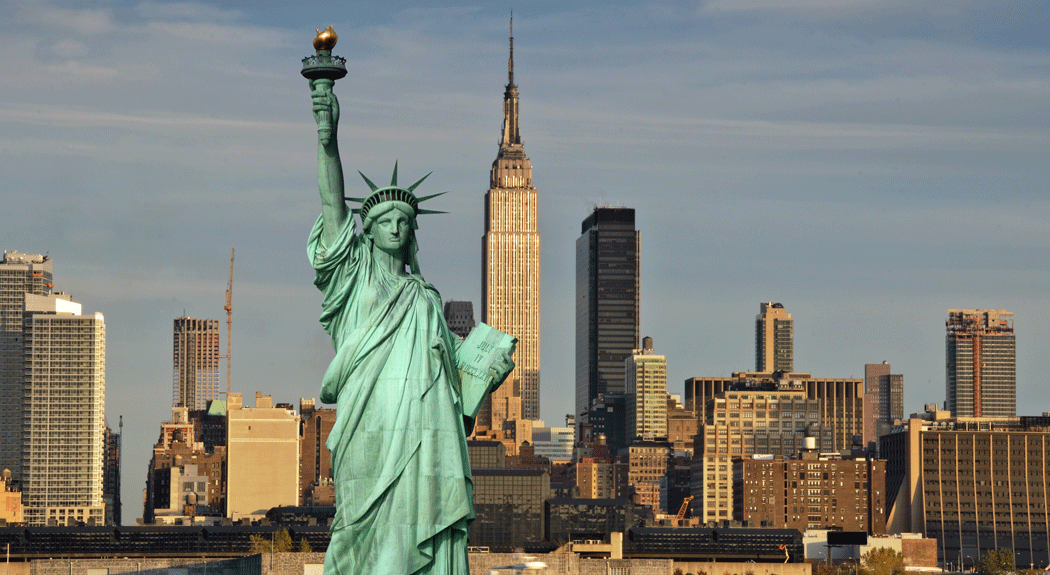 Statue of Liberty with NYC in the background.